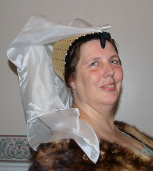 Brocade with a Black Edge finished with Pearls and a fine Silk Veil