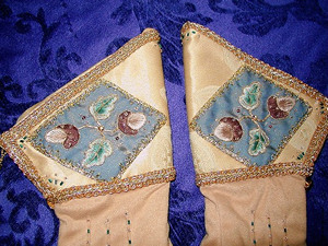 Detail of goldwork and silkwork hand embroidered gloves Detail of goldwork and silkwork hand embroidered gloves