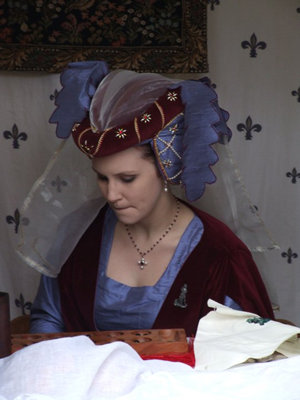 Burgundy Velvet and Blue Silk Heart Shaped Hennin, with Cream Pearls and Red Jewels and a Cream Veil. Blue Silk Dagging finishes the look based on a Tapestry showing Heart Shaped Hennin with dagging c.1450-55 Burgundy Velvet and Blue Silk Heart Shaped Hennin, with Cream Pearls and Red Jewels and a Cream Veil. Blue Silk Dagging finishes the look based on a Tapestry showing Heart Shaped Hennin with dagging c.1450-55