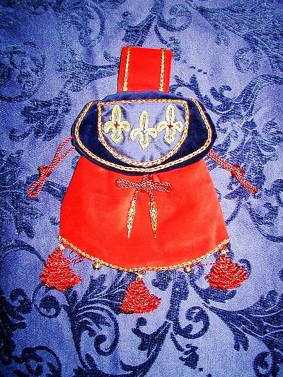 Red and blue velvet pouch with classic fleur-de-lys reproduced in goldwork Red and blue velvet pouch with classic fleur-de-lys reproduced in goldwork