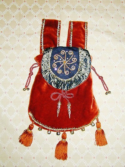 Rust velvet pouch with black linen embroidered with goldwork spangles Rust velvet pouch with black linen embroidered with goldwork spangles