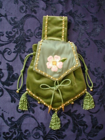 Pale Green Velvet Pouch with Green Silk Flap, embroidered with a Dog Rose in Silks, surrounded with a fine edge of Gold. Pale Green Velvet Pouch with Green Silk Flap, embroidered with a Dog Rose in Silks, surrounded with a fine edge of Gold.