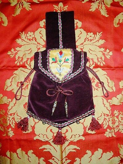 Burgundy velvet pouch with goldwork and silkwork reproduced from decoration in La Sainte-Chapelle, Paris Burgundy velvet pouch with goldwork and silkwork reproduced from decoration in La Sainte-Chapelle, Paris