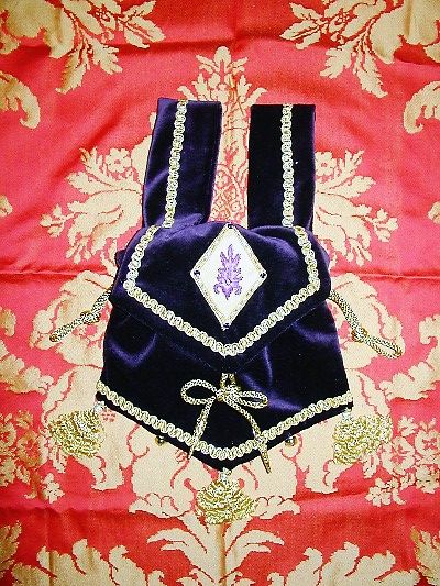 Purple velvet and gold brocade pouch with goldwork, silk shading and jewels reproduced from an ecclesiastical motif from an altar front Purple velvet and gold brocade pouch with goldwork, silk shading and jewels reproduced from an ecclesiastical motif from an altar front