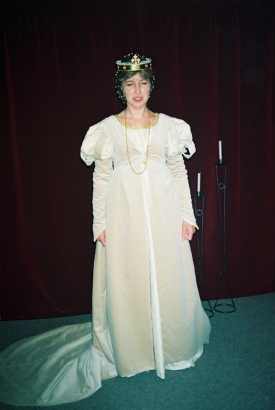 Front view of champagne velvet overdress with train Front view of champagne velvet overdress with train